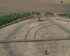 Aerial view of the 2004 excavation. The narrow palisade trenches in one of the four sectors have already been excavated.