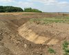 The ditch, about 1.5 m deep, was dug with a mechanical excavator. The reconstruction thus shows the original state of the ditch at the time when the circular ditched enclosure was in use.